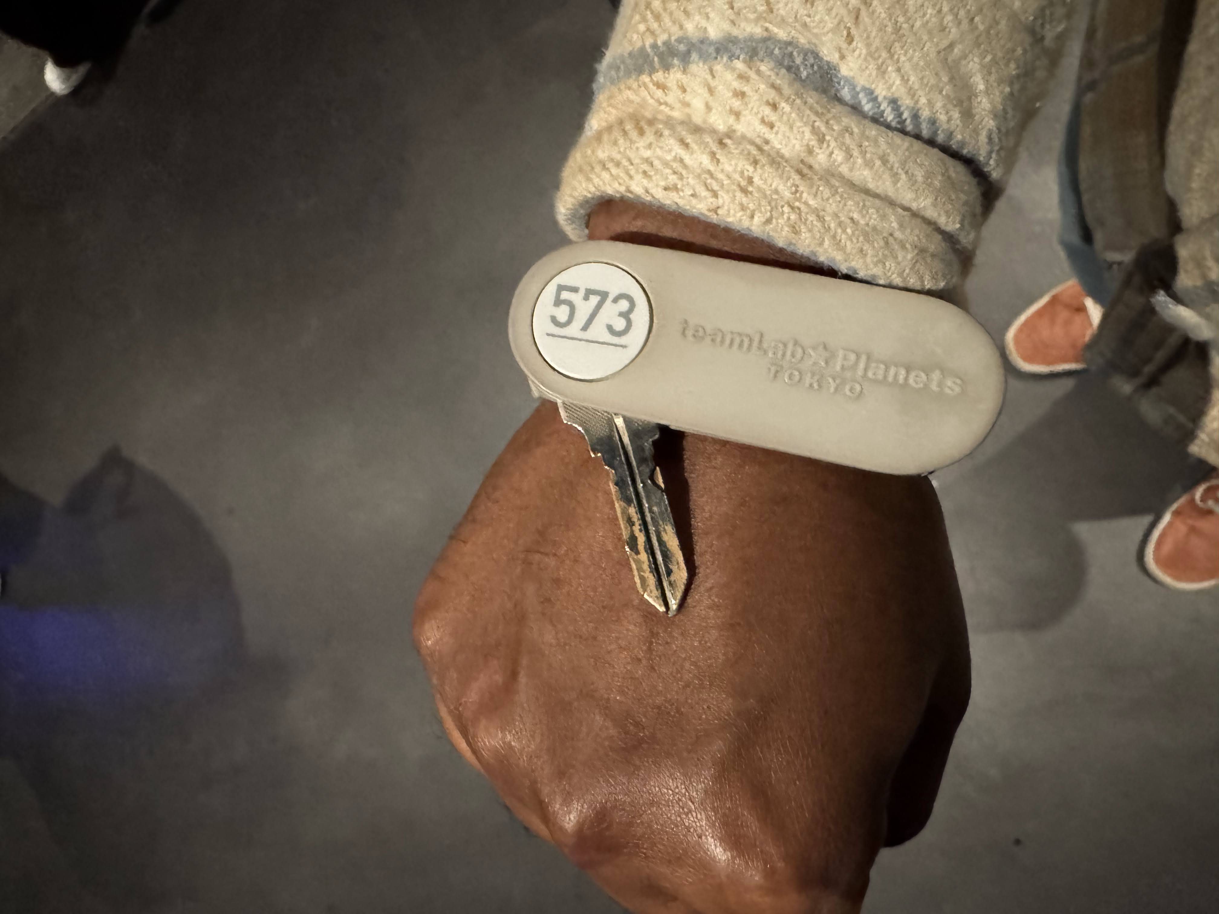 Locker key on a wristband with the number printed on it